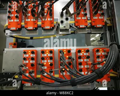 electrical wires connected to the power box on the production equipment. Each wire has its own number. Stock Photo