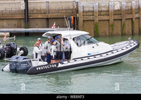 Cowes, Isle of Wight, Hampshire UK. 8th Aug 2019.  Kings Cup Sailing hosted by Duke and Duchess of Cambridge takes place a day early because of the weather forecast. Kate, Kate Middleton, and Will, Prince William, make their way to their boats on Targa Protector rigid hull inflatable boat RIB. Credit: Carolyn Jenkins/Alamy Live News Stock Photo