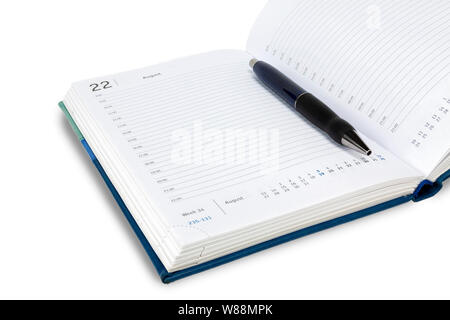 Automatic pen lies on the weekly. All on a white background, isolate. Stock Photo