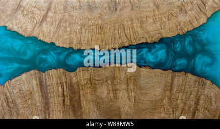 Casting epoxy resin Stabilizing Afzelia burl wood blue abstract art background texture for blanks Stock Photo