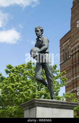 A bronze statue of William Webb Ellis outside Rugby School in Rugby ...