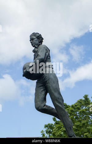 A bronze statue of William Webb Ellis outside Rugby School in Rugby ...