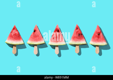 Piece of Watermelon on blue backgroud. Minimal style Stock Photo