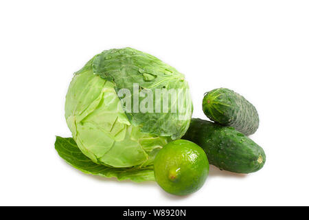 Healthy eating. Ingredients of salad: cabbage, lime and two cucumbers Stock Photo