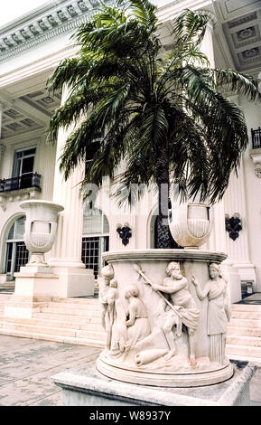 This sculpted marble urn adorns the grand entrance to Whitehall, the opulent winter home of oil and railroad magnate Henry M. Flagler and his third wife that was built in 1902 in Palm Beach on the east coast of Florida, USA. The 75-room Beaux Arts-style mansion was the focal point of Palm Beach's high-society social scene during America's Gilded Age. After Flagler died in 1913 at age 88 from a fall down a marble staircase in his home, the enormous structure became a hotel and then fell into disuse before being restored and reopened as the Flagler Museum in 1960. Stock Photo