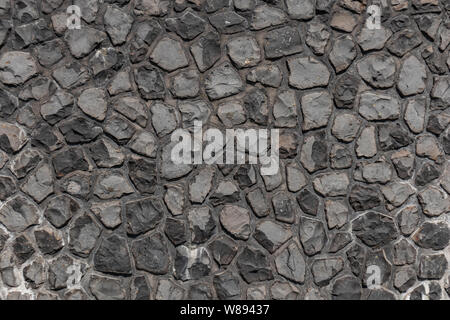 Black color cobblestone street texture, background, high angle, top view Stock Photo
