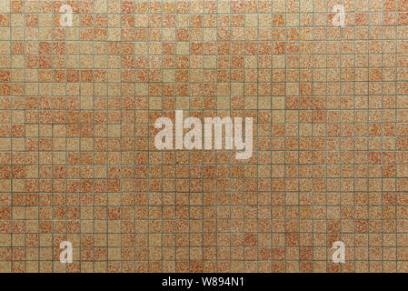 Old vintage style of various mix random tone of yellow mosaic tiles with grid pattern. Stock Photo