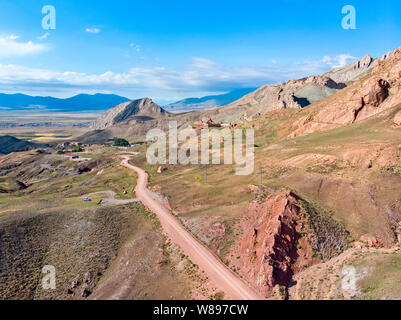 Aerial view of dirt roads on the plateau around Mount Ararat, dirt roads and breathtaking landscapes, winding roads, rocky peaks and hills. Turkey Stock Photo