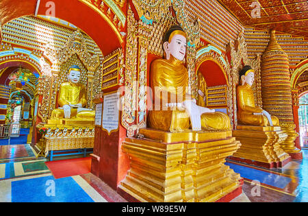 MONYWA, MYANMAR - FEBRUARY 22, 2018: The colorful Thanboddhay Pagoda with many arched is famous for its unusual architecture and intricate decorations Stock Photo