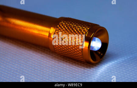 orange flashlight switched on in studio light Stock Photo