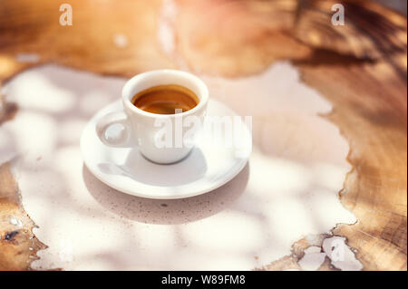 top view a cup of espresso coffee on wooden table background Stock Photo