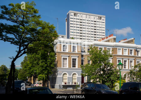 Poynter House high rise tower block behind expensive Notting Hill house houses, Kensington and Chelsea, London, UK Stock Photo