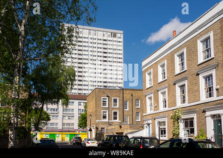 Tower block overlooking Georgian terraced houses on St. James's Gardens, The Royal Borough of Kensington and Chelsea, Notting Hill, London, UK Stock Photo