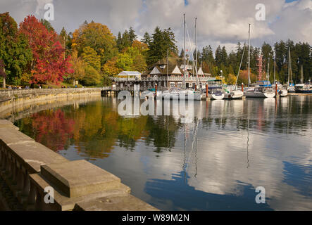 Coal Harbor Autumn Vancouver. Stanley Park fall colours reflect in Coal Harbour by the Vancouver Rowing Club. Stock Photo