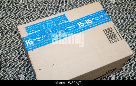 PARIS, FRANCE - JUL 4 2109: View from above of new Amazon Prime Day cardboard parcel with special blue scotch tape for the Prime Day Stock Photo
