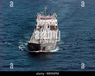 Shadowed by assets of the multinational  Maritime Interception Force the Russian-flagged tanker Volgoneft-147 steams on Feb. 3, 2000.  The Volgoneft-147 was boarded in international waters on Feb. 2 during interception operations conducted by the Ticonderoga class cruiser USS Monterey (CG 61).  While operating under the authority of United Nations Security Council Resolution 665, the multinational Maritime Interception Force routinely intercepts and boards vessels suspected of carrying contraband. Stock Photo