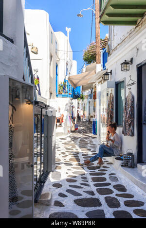 Mykonos, Greece - September 15th 2015: Typical narrow street in Chora. This is the main town on the island. Stock Photo