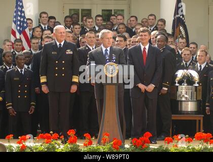 President George W. Bush delivers his remarks during the presentation of the Commander-In-Chief's Trophy to members of the U.S. Naval Academy Football team at a ceremony at the White House on April 20, 2005.  Bush hailed Navy's football team for winning the Commander-In-Chief's trophy for the second year in a row.  The trophy goes each year to the team with the best record in games between the three service academies. Navy finished the year with a school-record tying 10 victories; marking the first time in 99 years that Navy has won 10 football games in a single season. Navy beat Air Force 24- Stock Photo