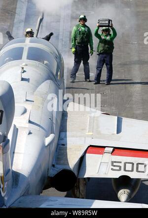 An EA-6B Prowler is directed onto the catapult in preparation for launch from the flight deck of the aircraft carrier USS Abraham Lincoln (CVN 72) on Sept. 15, 2005.  The Lincoln and its embarked Carrier Air Wing 2 are conducting training off the coast of Southern California.  The Prowler is assigned to Electronic Attack Squadron 131. Stock Photo