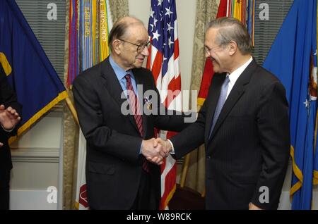 Secretary of Defense Donald H. Rumsfeld (right) congratulates Federal Reserve Chairman Alan Greenspan (left) after awarding him the Department of Defense Medal for Distinguished Public Service at the Pentagon in Arlington, Va., on Jan. 23, 2006.  Greenspan was cited for his contribution '...to a strong national defense by helping promote the continued and steady growth of the economy of the United States'. Stock Photo