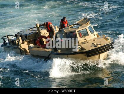 A Navy Lighter, Amphibious Resupply, Cargo vehicle, more commonly know as a LARC, heads toward the well deck of the USS Iwo Jima (LHD 7) after performing amphibious exercises in the Atlantic Ocean on Jan. 9, 2006.  The LARC and its crew are attached to Beach Master Unit 2 from Naval Amphibious Base Little Creek, Va. Stock Photo