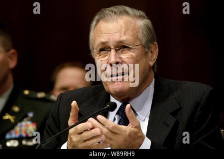 Secretary of Defense Donald H. Rumsfeld responds to a senator's question during his testimony before the Senate Armed Services Committee at the Dirksen Senate Office Building in Washington, D.C., on Feb. 7, 2006.  Chairman of the Joint Chiefs of Staff Gen. Peter Pace, U.S. Marine Corps, and Chief of Staff of the U.S. Army Gen. Peter Schoomaker joined Rumsfeld in testifying before the committee. Stock Photo