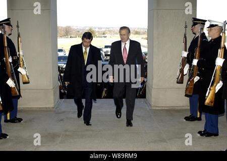 Secretary of Defense Donald H. Rumsfeld (right) escorts Colombian Minister of National Defense Camilo Ospina through an honor cordon and into the Pentagon on Feb. 28, 2006.  Rumsfeld, Ospina and their senior advisors will meet over a working lunch to discuss security issues of of mutual interest. Stock Photo