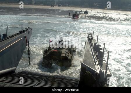 A Republic of Korea amphibious assault vehicle enters the surf from a U.S. Navy landing craft utility during an Exercise Foal Eagle combined amphibious landing in Manripo, Republic of Korea, on March 30, 2006.  Foal Eagle is a joint exercise between the Republic of Korea and the U.S. Armed Forces designed to enhance war-fighting skills.