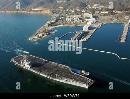 The nuclear-powered aircraft carrier USS Nimitz (CVN 68) passes Naval Base Point Loma, Calif., while returning home to San Diego, Calif., on Sept. 30, 2007, following a six-month deployment. Stock Photo