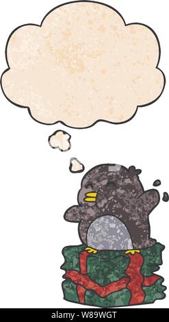 cartoon penguin on present with thought bubble in grunge texture style Stock Vector