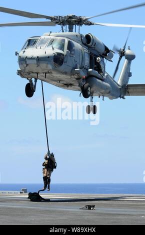 The explosive ordnance disposal flight team reports on scene to a ...