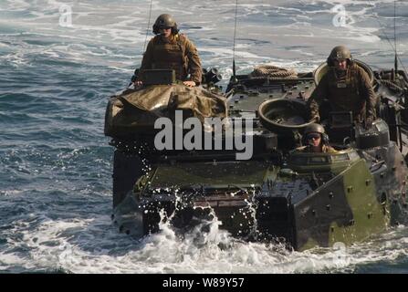 U.S. Marines from the Special Purpose Marine Air Ground Task Force 24 from Camp Pendleton, Calif., prepare to enter the well deck of the USS New Orleans (LPD 18) in amphibious assault vehicles in the eastern Pacific Ocean on June 11, 2010. Stock Photo