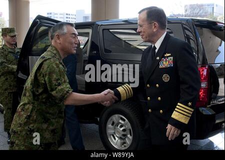 Chairman of Japan's Joint Chiefs of Staff Gen. Ryoichi Oriki greets Chairman of the Joint Chiefs of Staff Adm. Mike Mullen in Tokyo, Japan, on Dec. 9, 2010.  Mullen traveled to Japan to meet with defense officials there reassuring the strength of the U.S.-South Korean alliance amid escalating tensions on the Korean Peninsula. Stock Photo