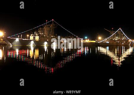 The guided-missile frigates USS Underwood (FFG 36) and USS Halyburton (FFG 40) are decorated with lights for a holiday lighting contest at Naval Station Mayport, Fla., on Dec. 15, 2010. Stock Photo