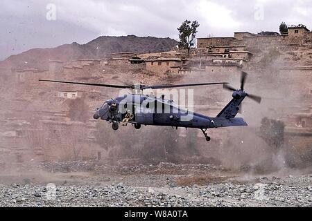 A UH-60 Black Hawk helicopter lands to medically evacuate an Afghan commando injured by insurgent small arms fire in the Sar Kani district of Afghanistan's Kunar province on March 7, 2012. Stock Photo