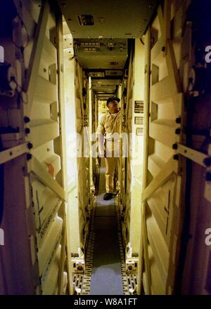 Chief Petty Officer Jackie Staton inspects the Tomahawk missile launch tubes aboard the Spruance-class destroyer USS John Young (DD 973) as the ship operates in the Persian Gulf on Feb. 9, 1998.  The John Young is deployed from its homeport of San Diego, Calif., to the Persian Gulf in support of Operation Southern Watch which is the U.S. and coalition enforcement of the no-fly-zone over Southern Iraq.  Staton is a Navy gunner's mate. Stock Photo