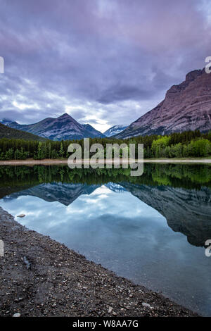 Sunrise Reflections at Wedge Pond in Kananaskis Country, Alberta Stock Photo