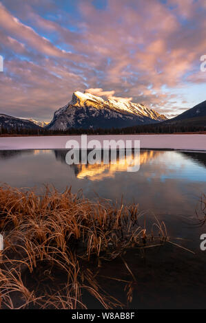 Rundle Mountain reflecting in the Vermillion Lakes in Banff National Park Stock Photo