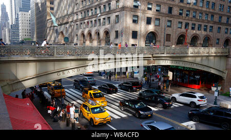 People and bicyclists on the Park Avenue Viaduct over Grand Central Terminal in Midtown Manhattan, New York City. Stock Photo