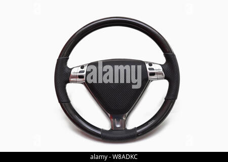 Sports car steering wheel with multi-function control buttons made of leather and carbon fiber on a white isolated background Stock Photo