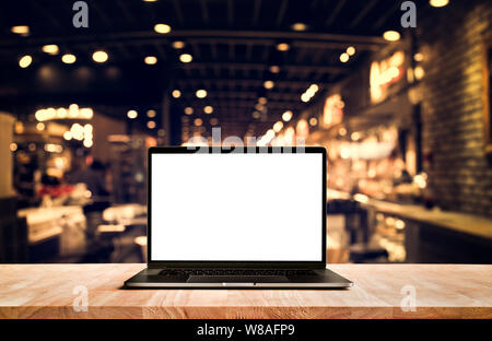 Modern computer,laptop with blank screen on table cafe shop backgrounds Stock Photo