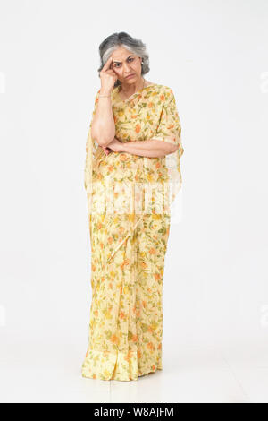 Senior woman suffering from headache Stock Photo