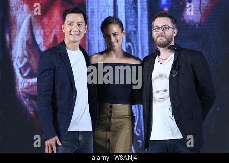 (From left) Hong Kong actor Daniel Wu, American actress Paula Patton and English film director Duncan Jones, also known as Zowie Bowie, pose at a pres Stock Photo