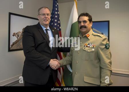 Deputy Secretary of Defense Bob Work poses for a photo as he greets Pakistani Chief of Army Staff General Raheel Sharif. Stock Photo