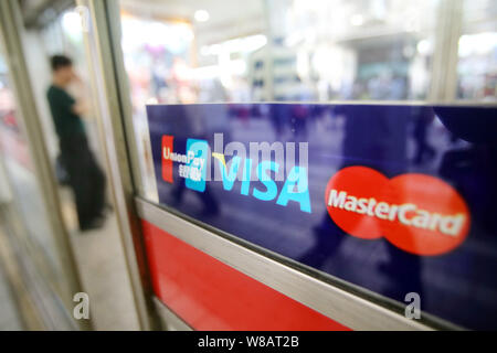 --FILE--Logos of China UnionPay, Visa and MasterCard are pictured at a ...