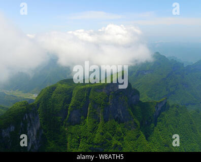 Landscape of the sea of clouds after rainfall in Tianmen Mountain (or Tianmenshan Mountain) in Zhangjiajie National Forest Park in Zhangjiajie city, c Stock Photo