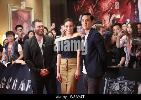 (From left) English film director Duncan Jones, also known as Zowie Bowie, American actress Paula Patton and Hong Kong actor Daniel Wu pose at a press Stock Photo