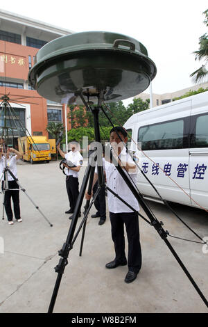 Chinese radio management officers monitor radio signals during an ...