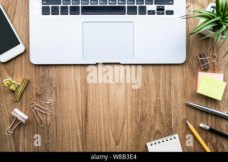 Top view of office desk table with modern laptop and accessories objects on wooden.Business,education concepts ideas/flat lay design Stock Photo