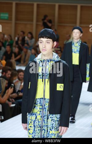 A model displays a new creation at the fashion show of Kenzo during the Paris Men's Fashion Week Spring/Summer 2017 in Paris, France, 25 June 2016. Stock Photo